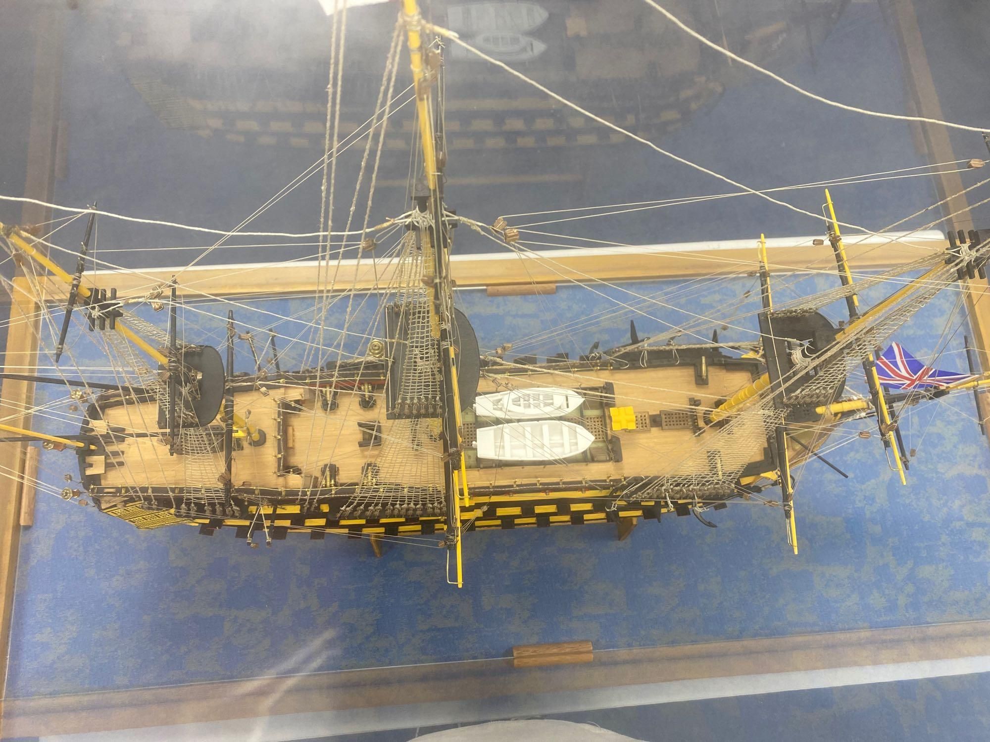 A model of the HMS Victory in perspex case, approximate length 120cm